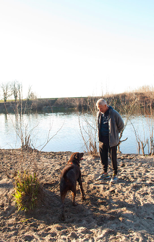Michael G with his dog Rufus at the river
